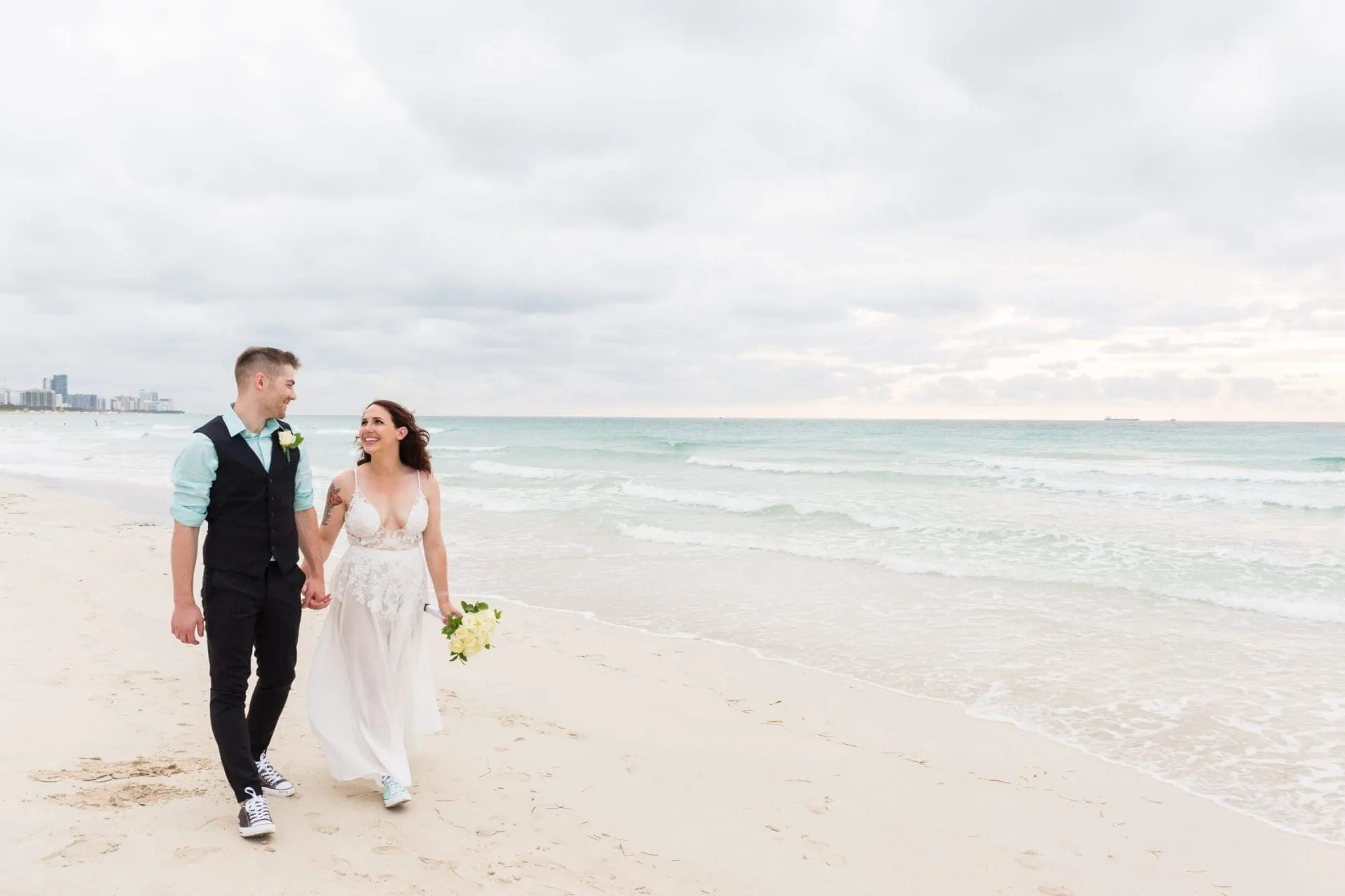 Wedding photos on Ocean Drive with classic pastel Art Deco hotels
