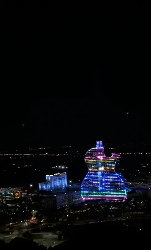 Guitar Hotel glowing with rainbow colors seen from above