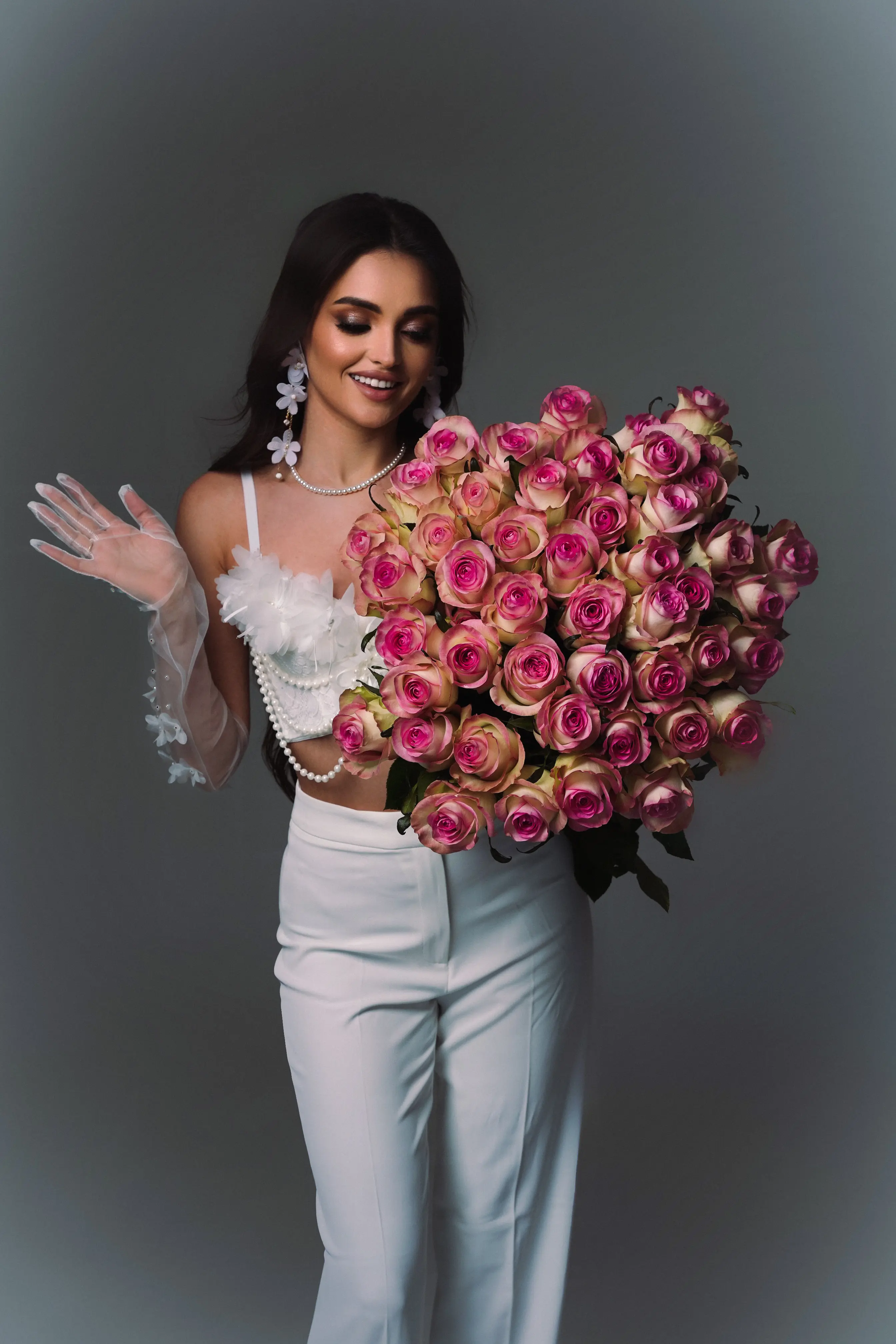 Roses and pearls — feminine luxe portrait with natural smile
